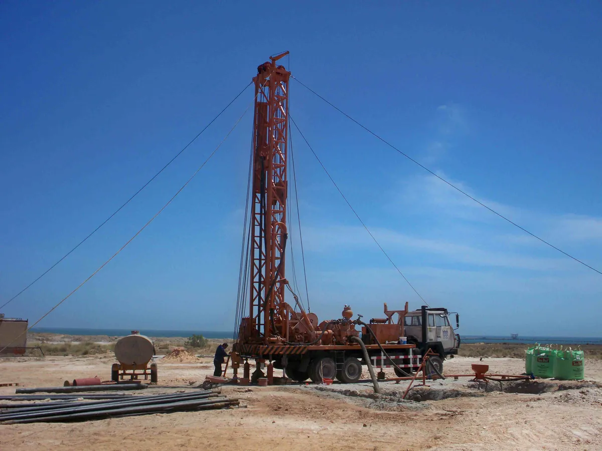 Water Well Drilling Rig Working at Field Site